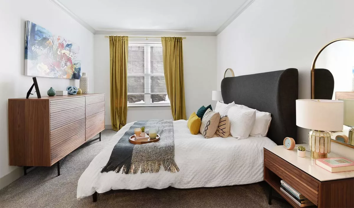 Luxurious bedroom with large bed and dresser